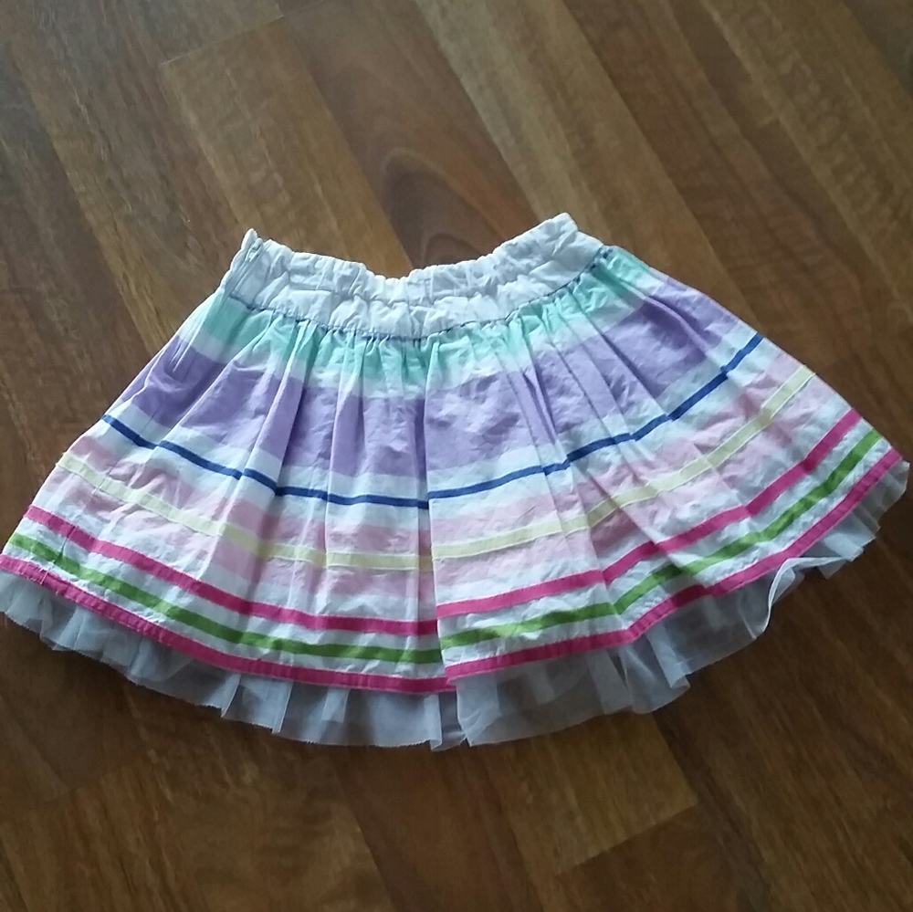 A young girls adjustable multi colored skirt